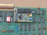 WD/900 circuit side, closeup of floppy controller daughtercard.  The DM1883B DMA controller is hidden from view by the daughterc