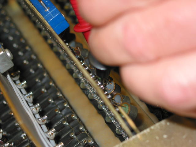 Rafael solders replacement transistor onto PDP-1 front panel I/O register indicator board
